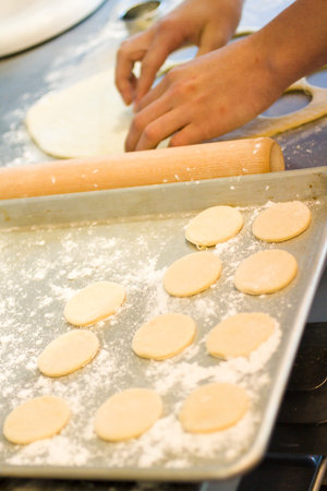Kids baking cookies in the cooking class.
