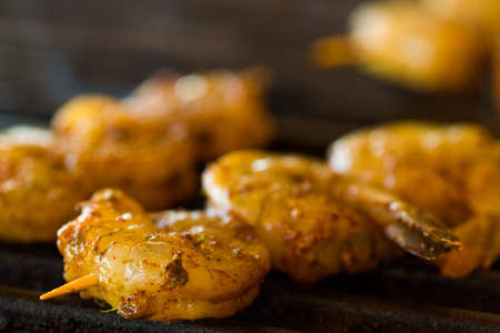 Grilling fresh shrimp on skewers.の写真素材
