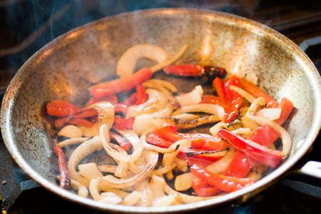 Frying vegetables for chicken fajitas.の写真素材