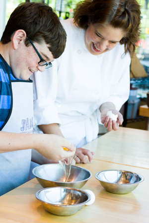 Kinds in cooking class learning how to cook and bake.のeditorial素材