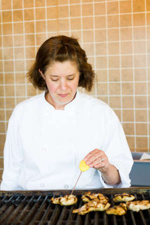 Kinds in cooking class learning how to cook and bake.のeditorial素材