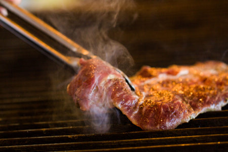 Slice of beef on barbecue grill.の写真素材