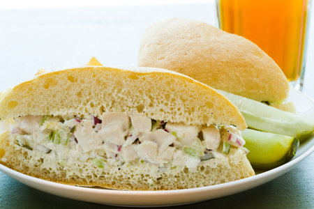 Gourmet chicken salad sandwich with chips on the side.の写真素材