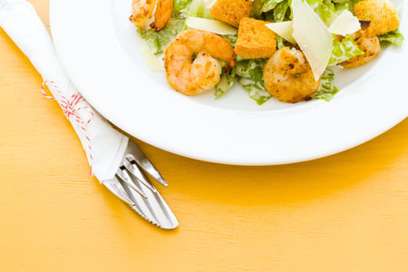 Gourmet caesar salad with grilled shrimp and croutons.の写真素材