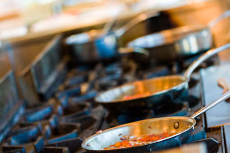 Kids learning how to cook in a cooking class.の写真素材