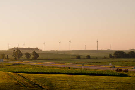 Wind turbines farm at sunrise in Iowa.の写真素材