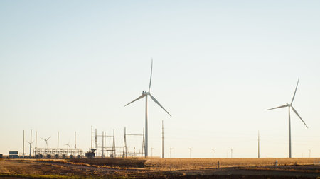 Wind turbines farm at sunset in Limon, Colorado.の写真素材