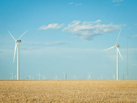 Wind turbines farm at sunset in Limon, Colorado.の写真素材