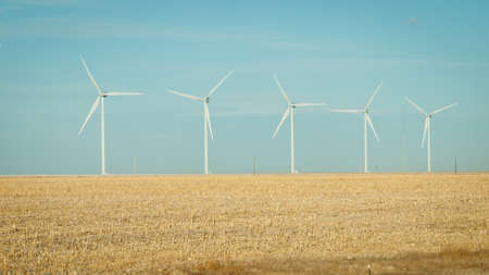 Wind turbines farm at sunset in Limon, Colorado.の写真素材