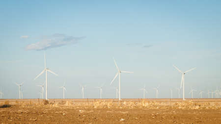 Wind turbines farm at sunset in Limon, Colorado.の写真素材