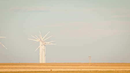 Wind turbines farm at sunset in Limon, Colorado.の写真素材