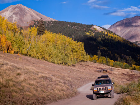 Jeep on Cinnamon Pass in autumn, Colorado.