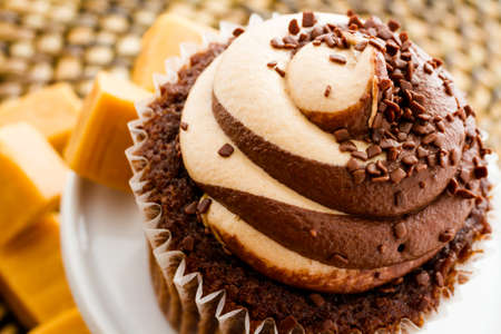 Gourmet chocolate caramel swirl cupcake with chocolate sprikles.の写真素材