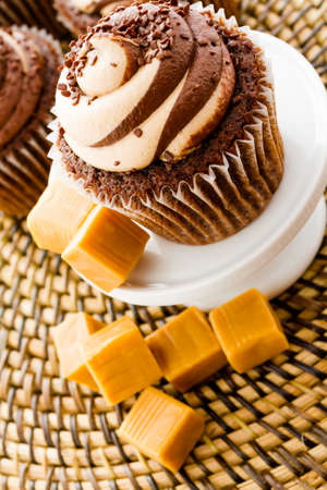 Gourmet chocolate caramel swirl cupcake with chocolate sprikles.の写真素材