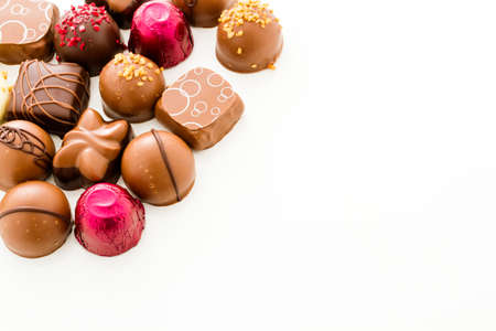 Assortedgourmet chocolate candies in different shapes and colors.の写真素材