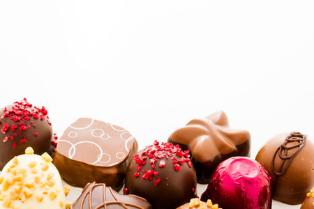 Assortedgourmet chocolate candies in different shapes and colors.