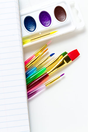 Variety of school supplies on a white background.