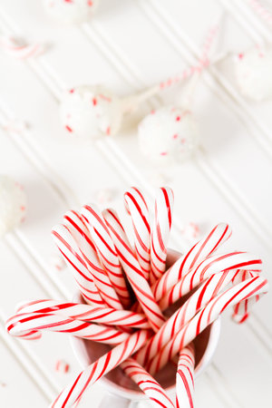 Peppermint chocolate cake dipped in white chocolate and candy cane bits.の写真素材