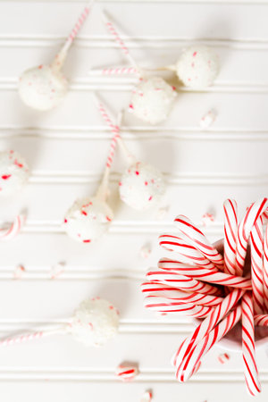 Peppermint chocolate cake dipped in white chocolate and candy cane bits.の写真素材