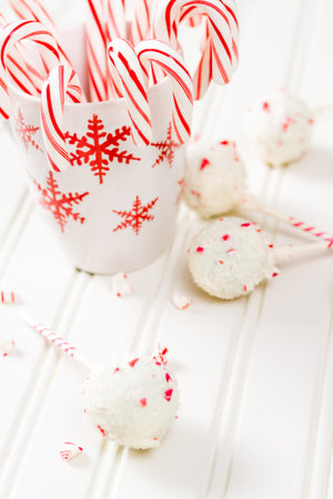Peppermint chocolate cake dipped in white chocolate and candy cane bits.の写真素材