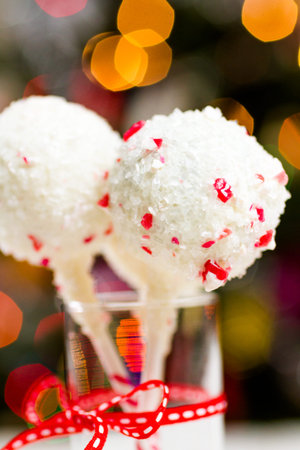 Peppermint chocolate cake dipped in white chocolate and candy cane bits.の写真素材