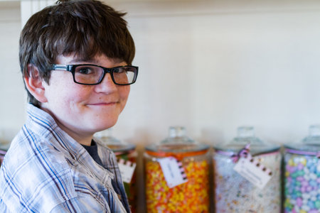 Teenager shopping at the boutique candy store.の写真素材