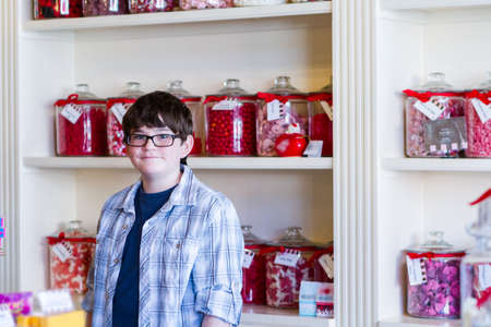 Teenager shopping at the boutique candy store.の写真素材