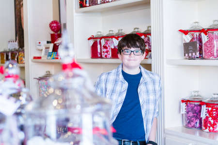 Teenager shopping at the boutique candy store.の写真素材
