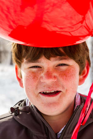 Teenager boy with Valentines Day gifts for his girlfriend.の写真素材