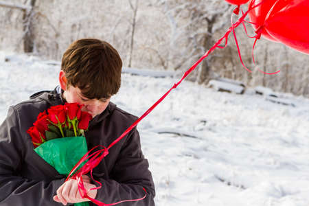 Teenager boy with Valentines Day gifts for his girlfriend.の写真素材