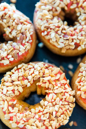 Variery of fresh donuts with different toppings from the local bakery shop.