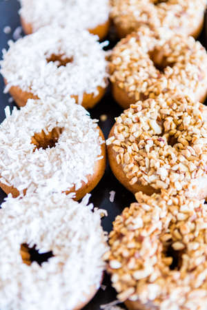 Row of fresh donuts from the local bakery shop.の写真素材