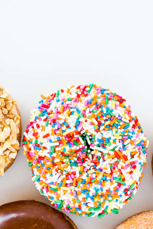 Variery of fresh donuts on a white background.の写真素材