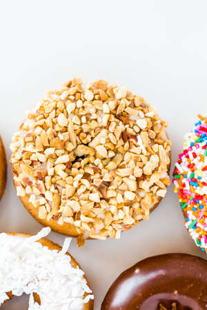 Variery of fresh donuts on a white background.の写真素材