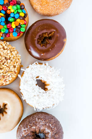 Variery of fresh donuts on a white background.のeditorial素材
