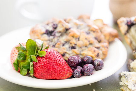 Cappuccino with fresh blueberry scone for breakfast.