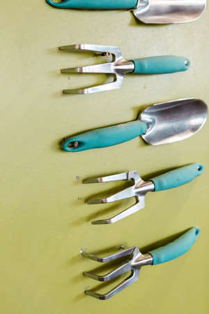 Garden tools are mounted on the wall as art.の写真素材