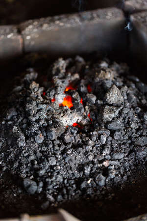 Coal in the forge of blacksmith shop.の写真素材
