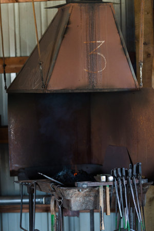 Working forge of the blacksmith in old shop.