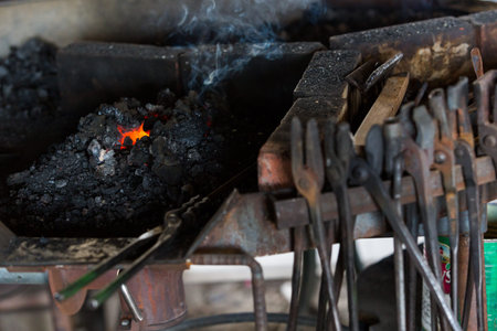 Working forge of the blacksmith in old shop.