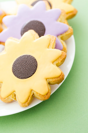 Easter sugar cookies in shape of flower with chocolate icing.