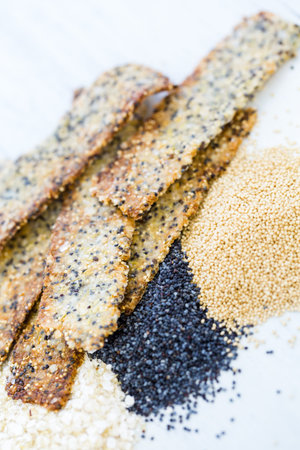 Gluten free crackers with seeds and quinoa flakes.