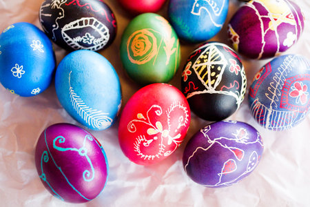 Hand painted Ukrainian Easter eggs decorated with folk designs using a wax resist method.
