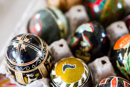 Hand painted Ukrainian Easter eggs decorated with folk designs using a wax resist method.