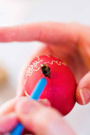Hand painted Ukrainian Easter eggs decorated with folk designs using a wax resist method.