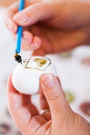 Hand painted Ukrainian Easter eggs decorated with folk designs using a wax resist method.