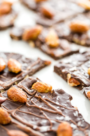 Gourmet slab of Almond Bark on a white background.