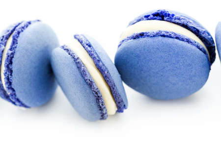 Gourmet small colorful French macarons with blueberry flavor.の写真素材
