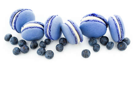 Gourmet small colorful French macarons with blueberry flavor.の写真素材