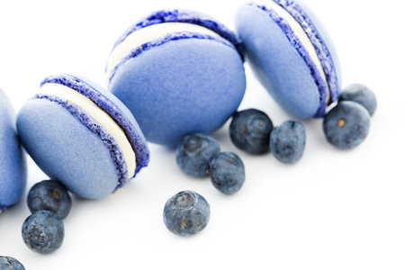 Gourmet small colorful French macarons with blueberry flavor.の写真素材
